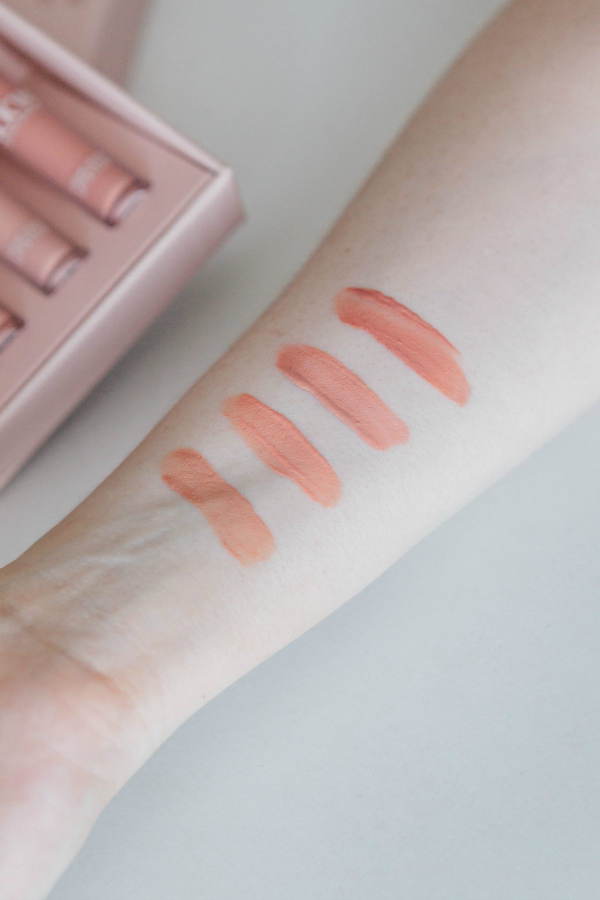 swatch of KKW by Kylie Cosmetics Creme Liquid Lipstick
