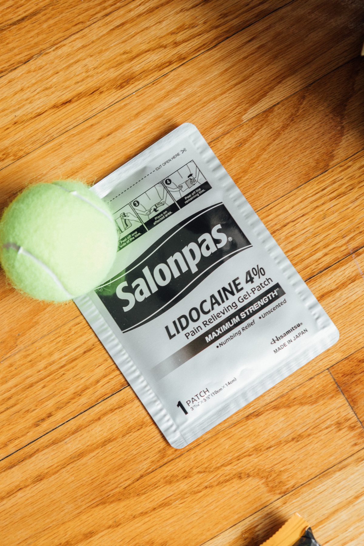 Tennis ball and lidocaine patches
