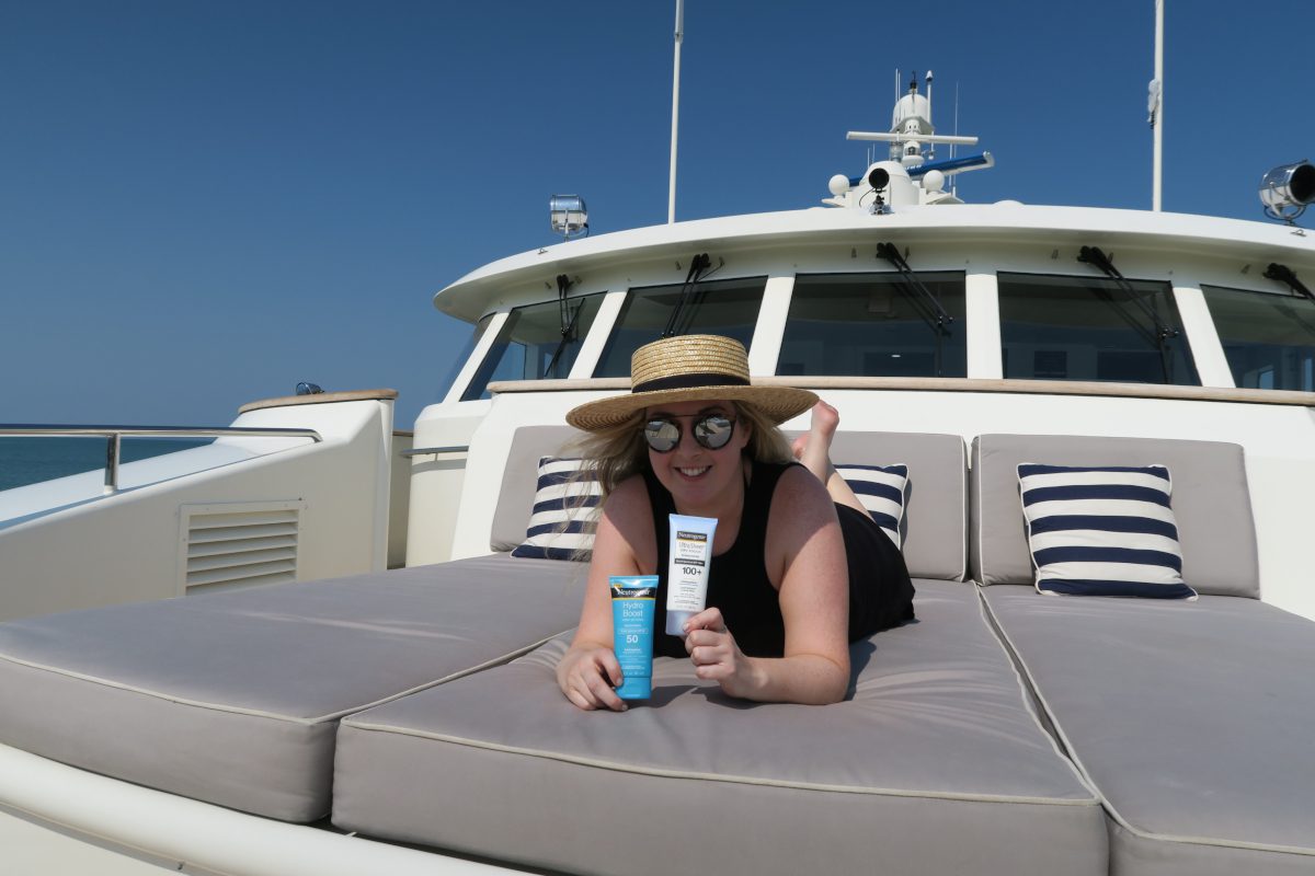 wearing Neutrogena sunscreen on a yacht