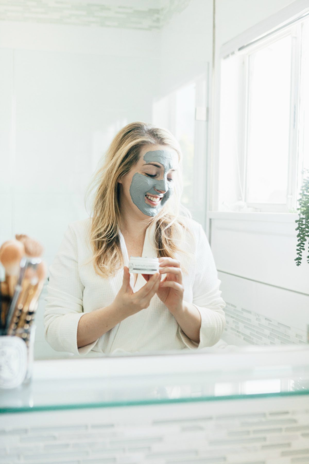 woman using Tree Hut Skincare mask 