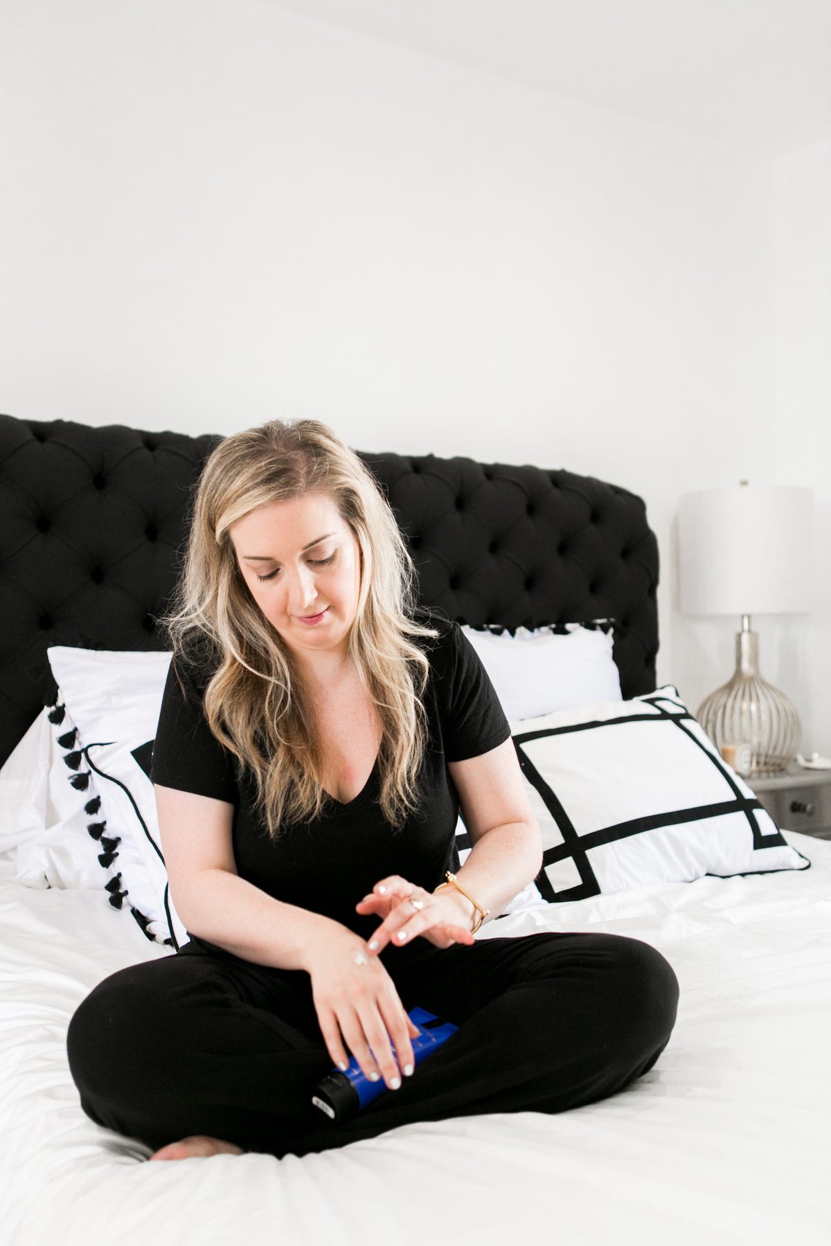 woman in her bed applying Products That Help Me Fall Asleep Fast