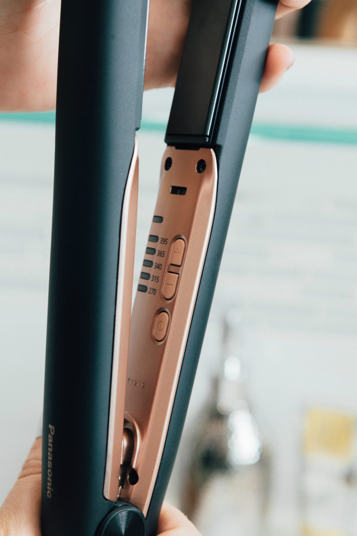 details of one of the flat irons in black and rose gold