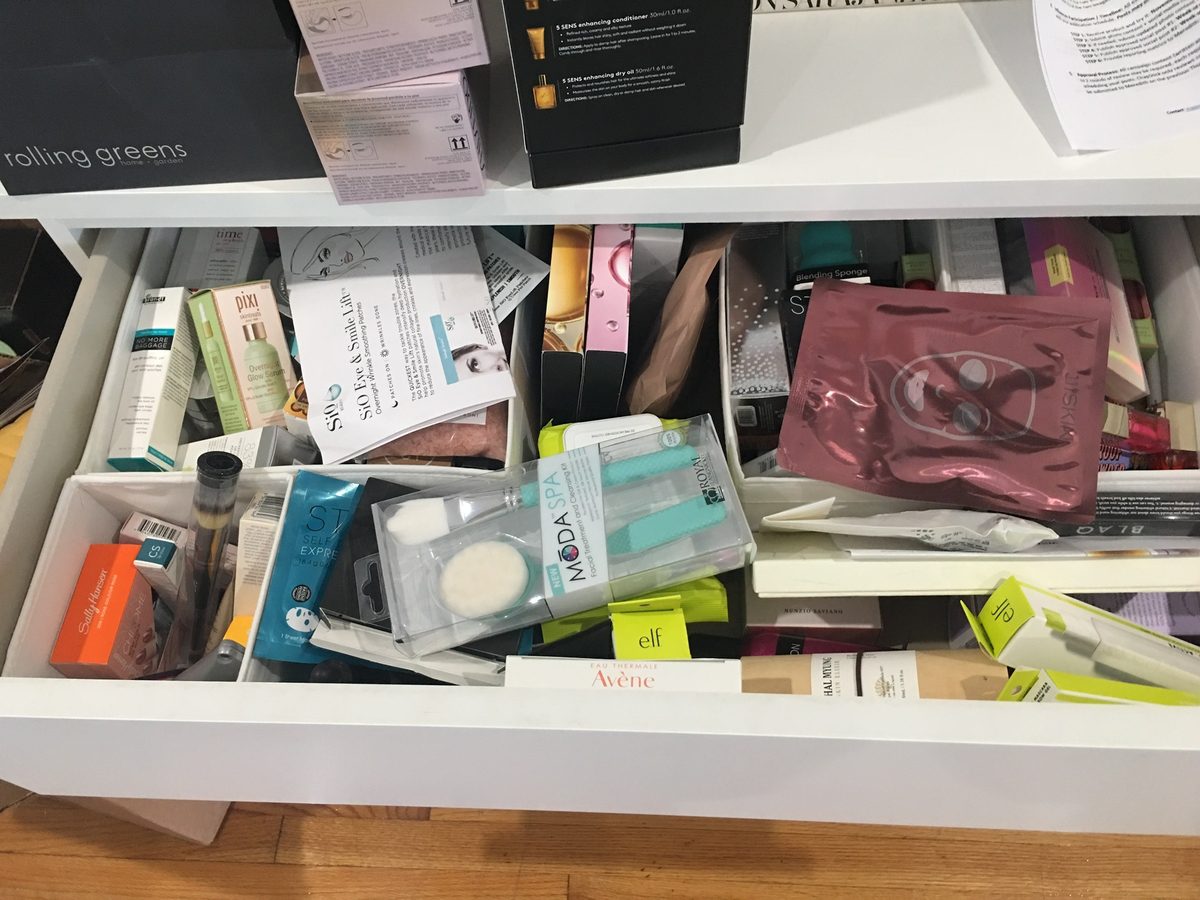 unorganized drawer with beauty products 