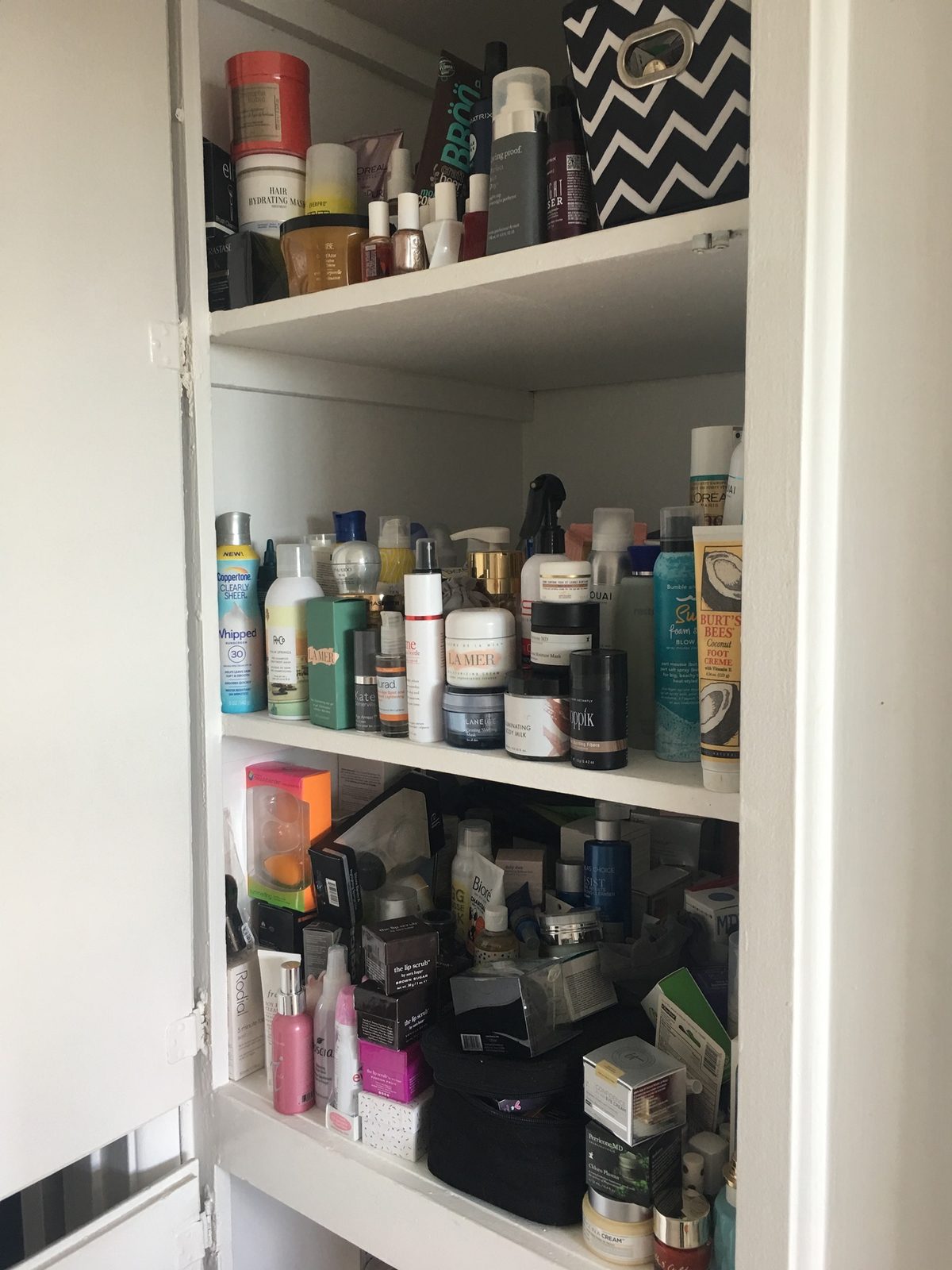 beauty closet with products before you Organize Your Beauty Products