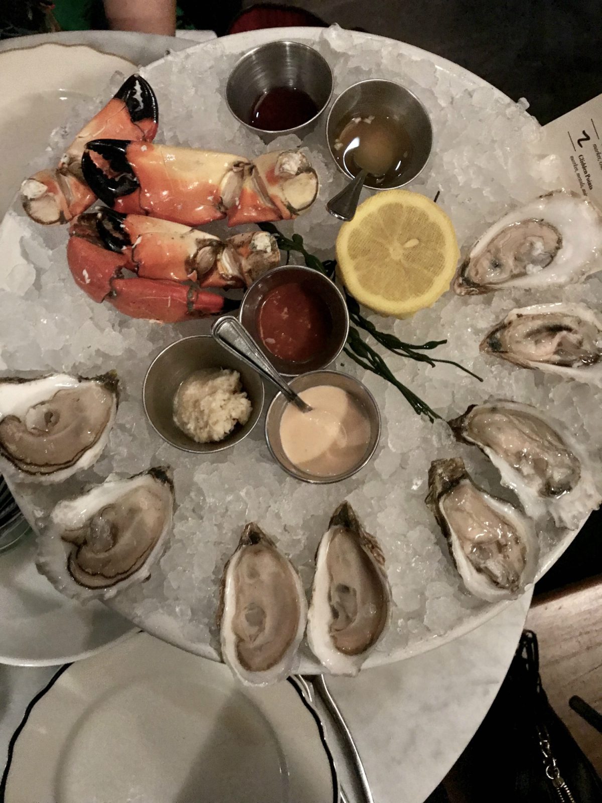 crabs and oysters served in a plate for Charleston Travel Guide