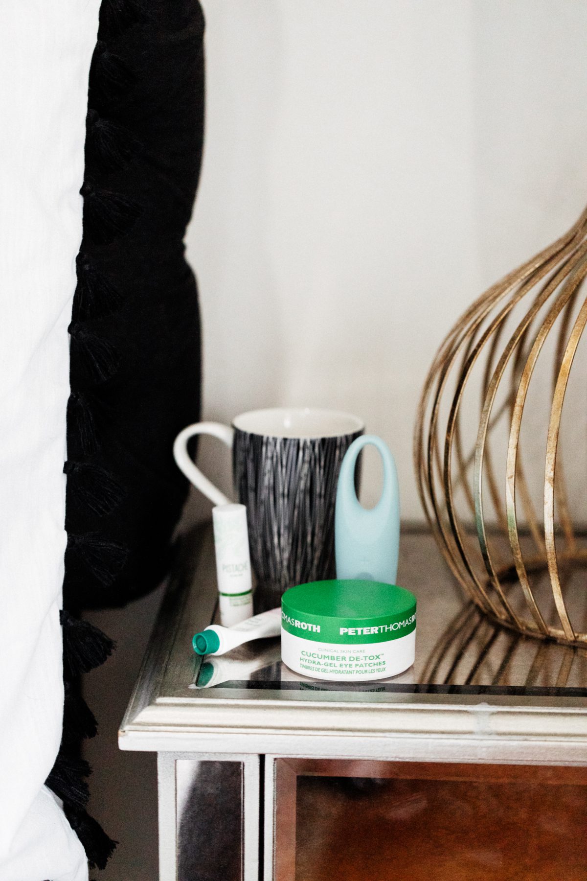 4 Skincare Products That Help When You're Sick on a bed side table