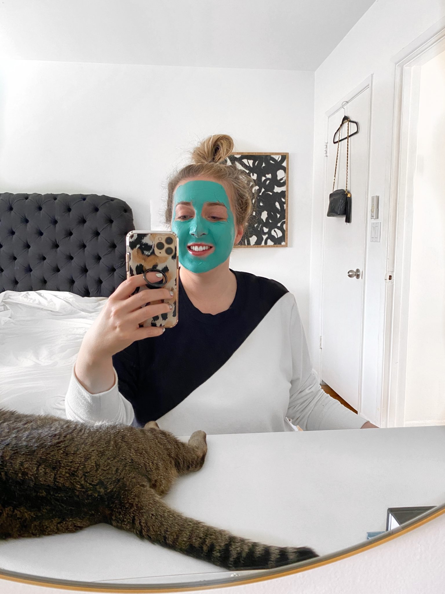 woman taking a selfie wearing a teal mask from Sephora Spring Savings Event