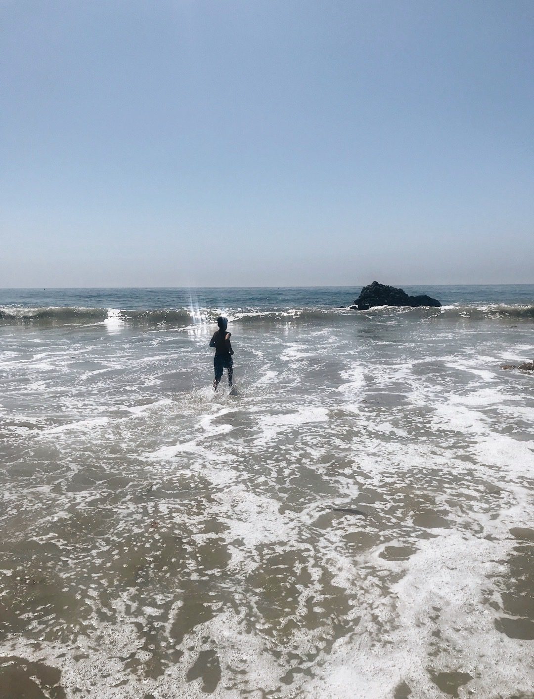 kid at the ocean for Malibu Travel Guide