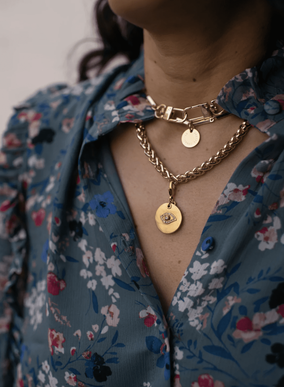 woman wearing Sequin x Pretty Connected Evil Eye Charm
